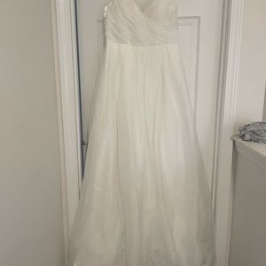 Soft white wedding gown. Small trail. Size 12. Never worn.